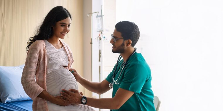 pregnant-woman-is-standing-her-husband